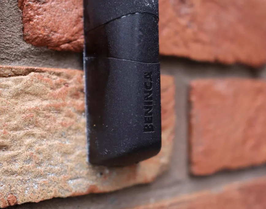 Beninca safety photocell fitted to a brick gate pier