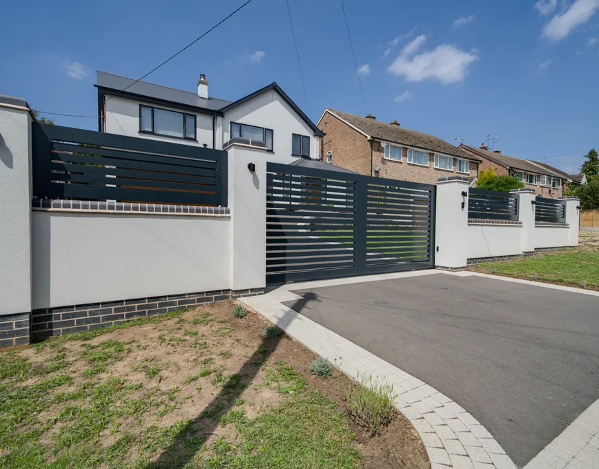 Anthracite aluminium sliding gate across a driveway, Cookhill