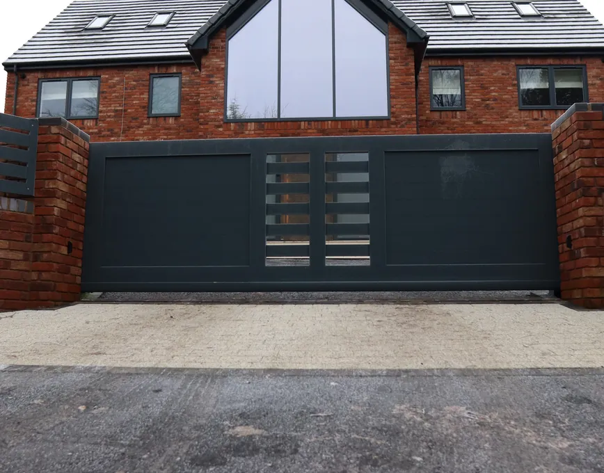 Modern anthracite gate with slatted panels at a new-build house