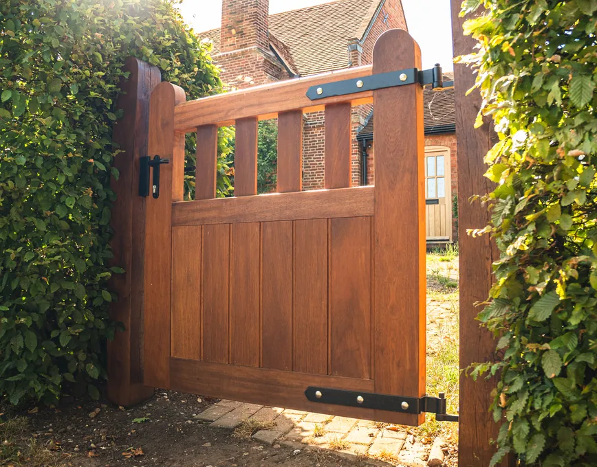 Timber pedestrian gate set into a hedge, Hanbury