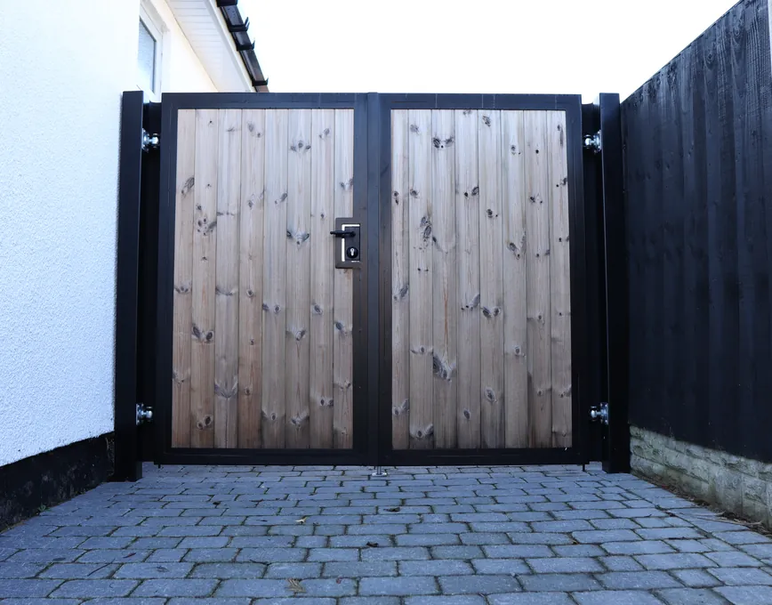 Modern timber-boarded gates in a black frame