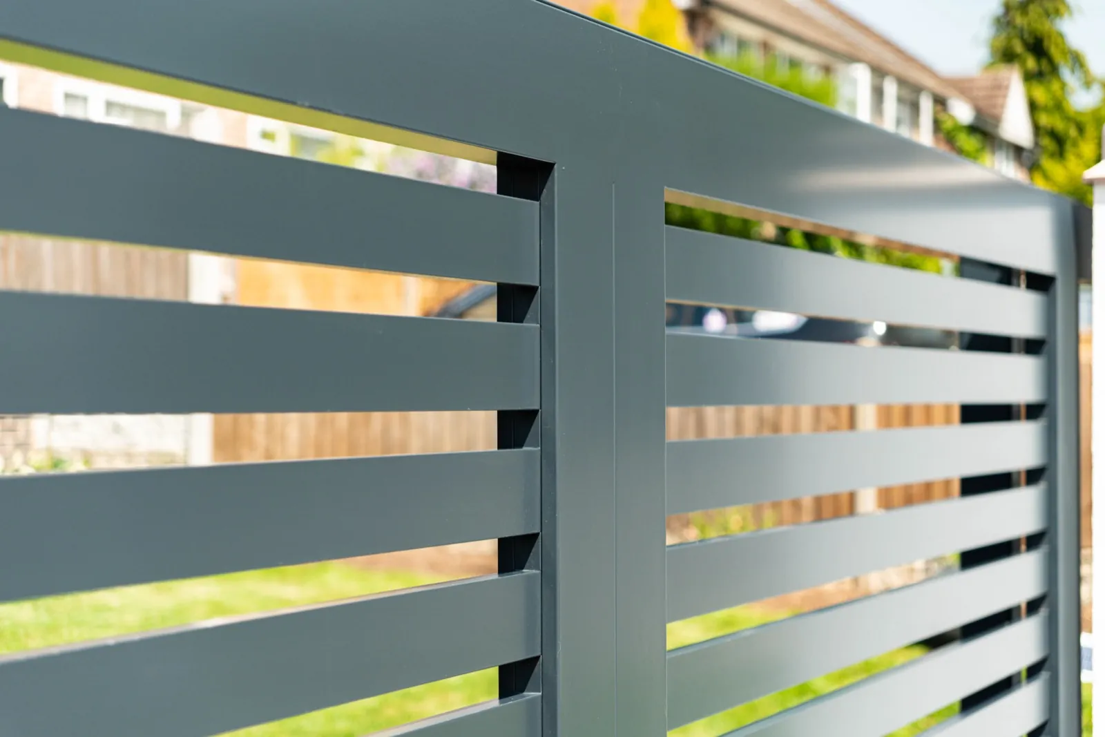 Close-up of horizontal slat aluminium gate panels in anthracite grey powder coat