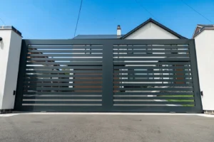 Contemporary anthracite aluminium horizontal-slat sliding driveway gate, front view, near Redditch