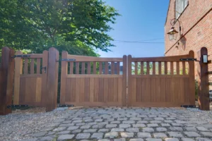 Traditional timber driveway gate with railed top, closed, in Hanbury