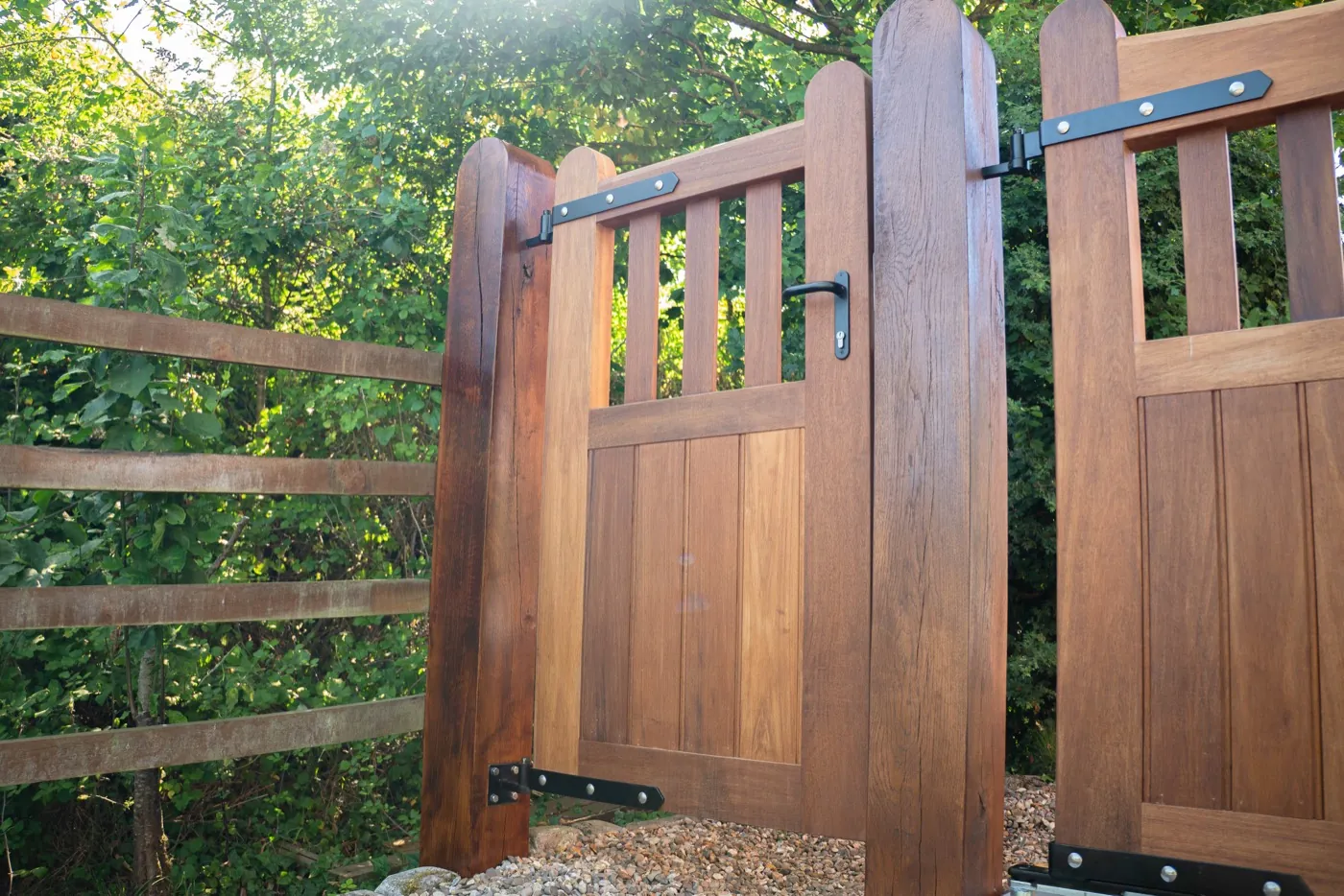 Timber driveway gate open beside its matching pedestrian gate, Hanbury