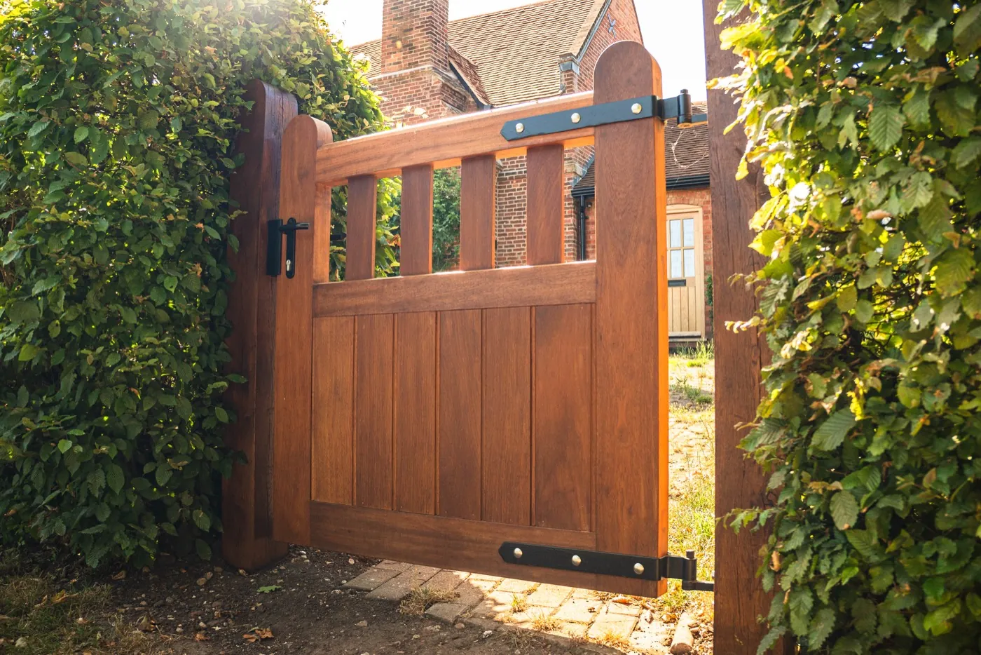 Timber pedestrian gate beside a hedge, Hanbury