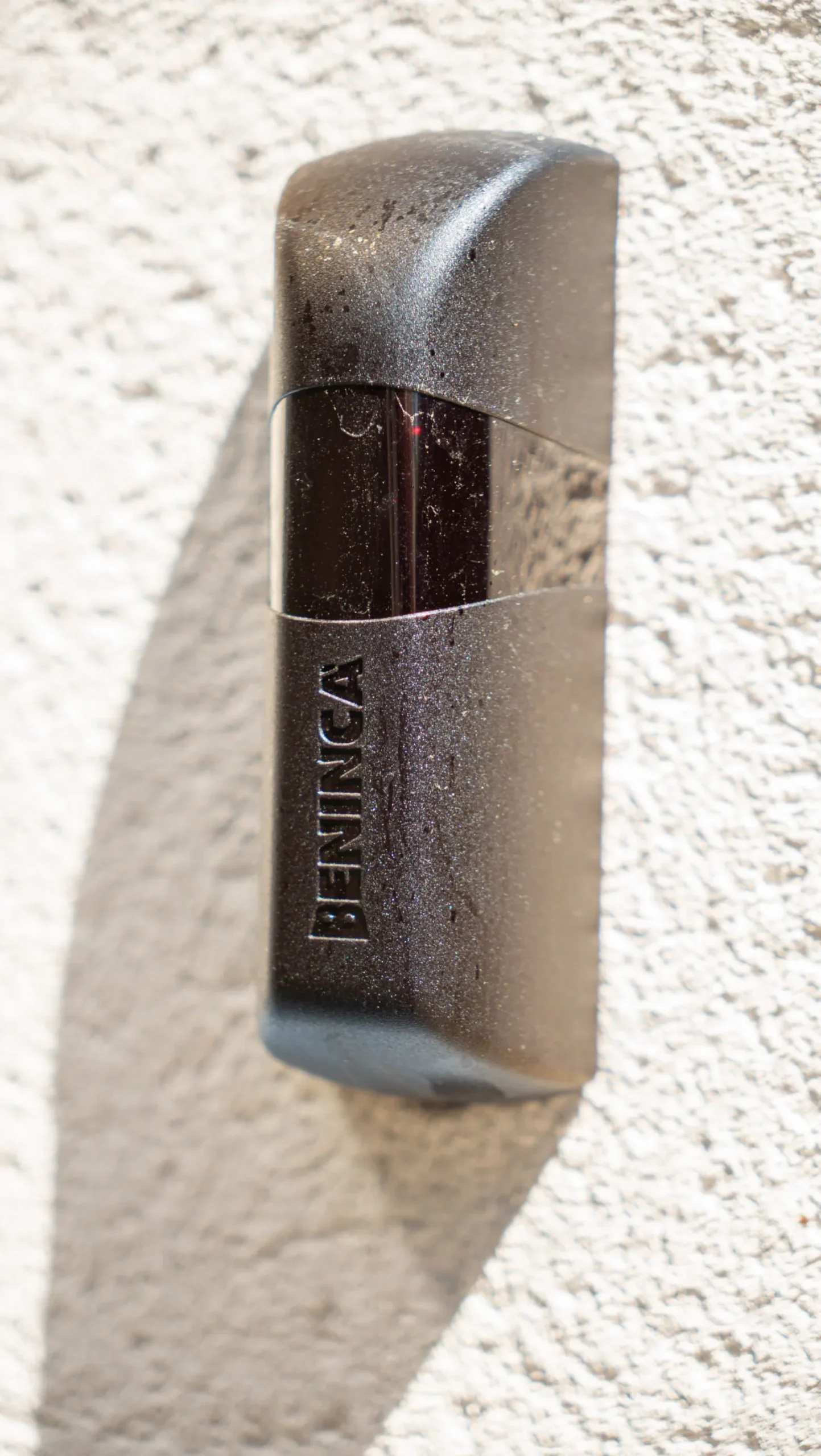 Beninca safety photocell fitted to a rendered gate pier