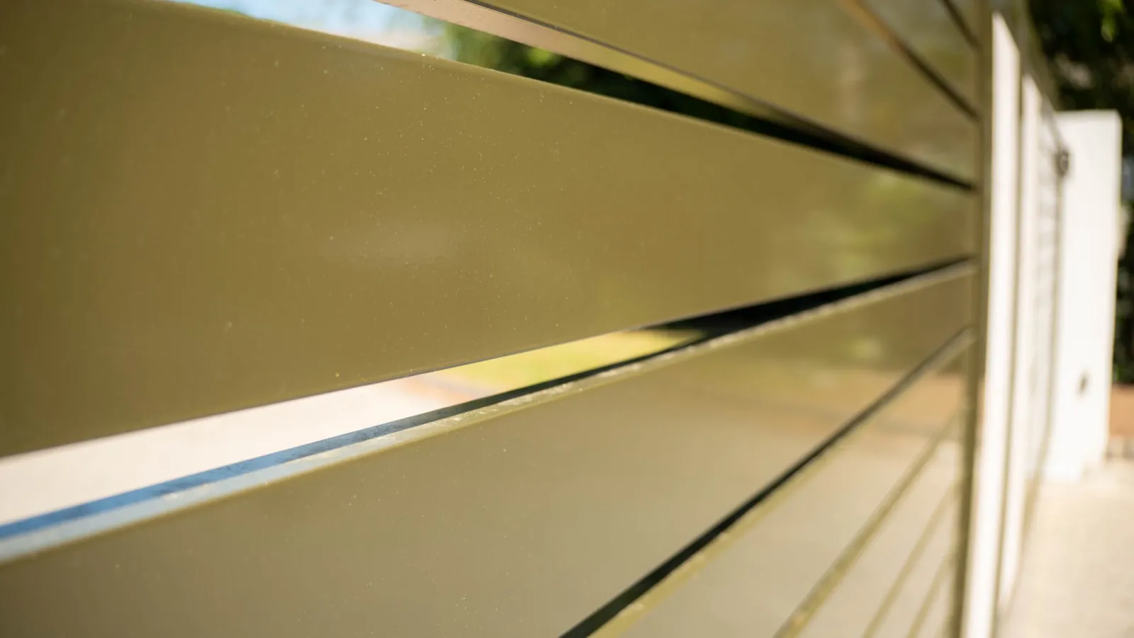 Close-up of the olive green powder-coated slats