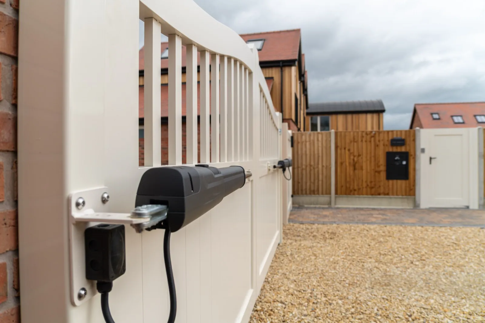 Beninca motor arm fitted to the inside of a cream swing gate